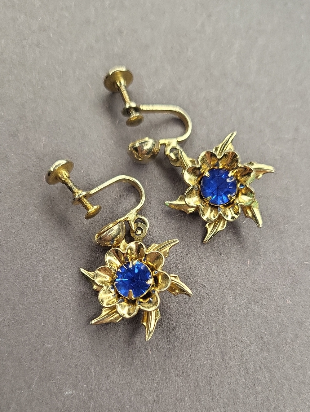Gold Floral Clip-On Earrings with Blue Crystal Center